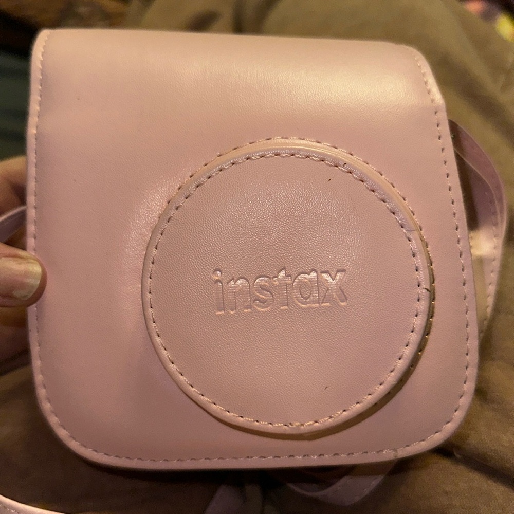 Camera
Works properly. Someone painted it white though.
With pink carry case .